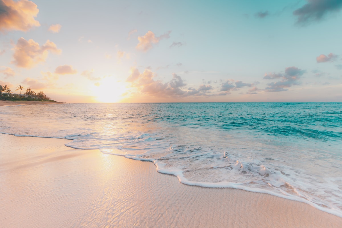 Romantic couple on beach at sunset